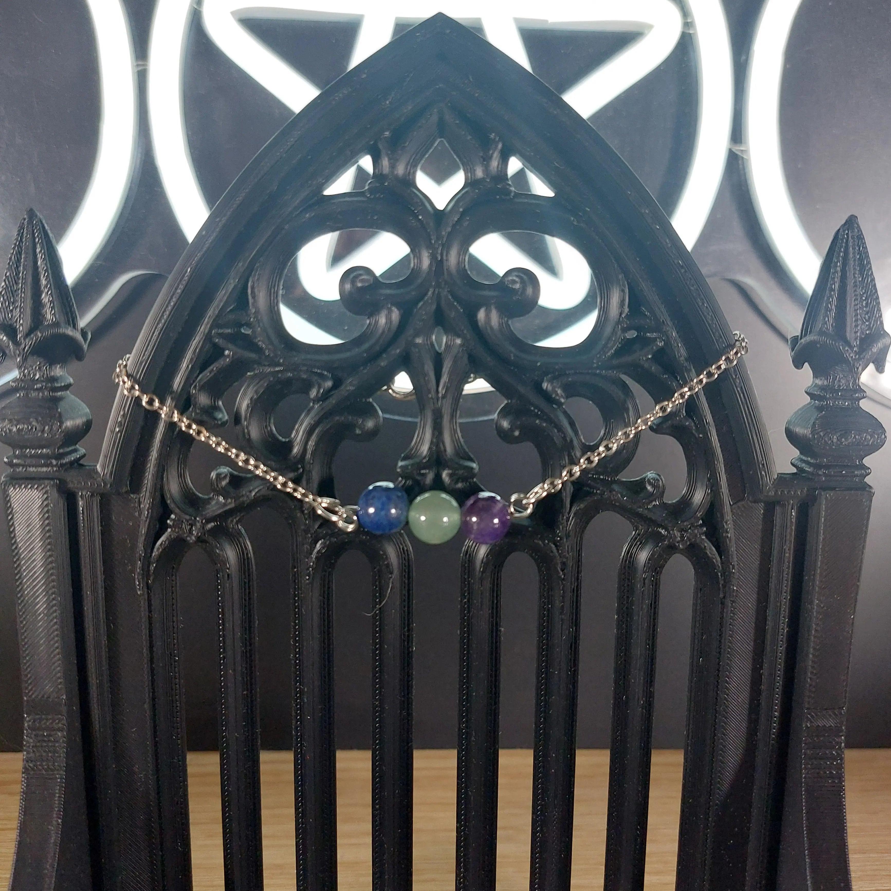 Aquarius Power Stones Bracelet with blue Lapis Lazuli, green Aventurine, and purple Amethyst beads on a silver chain.