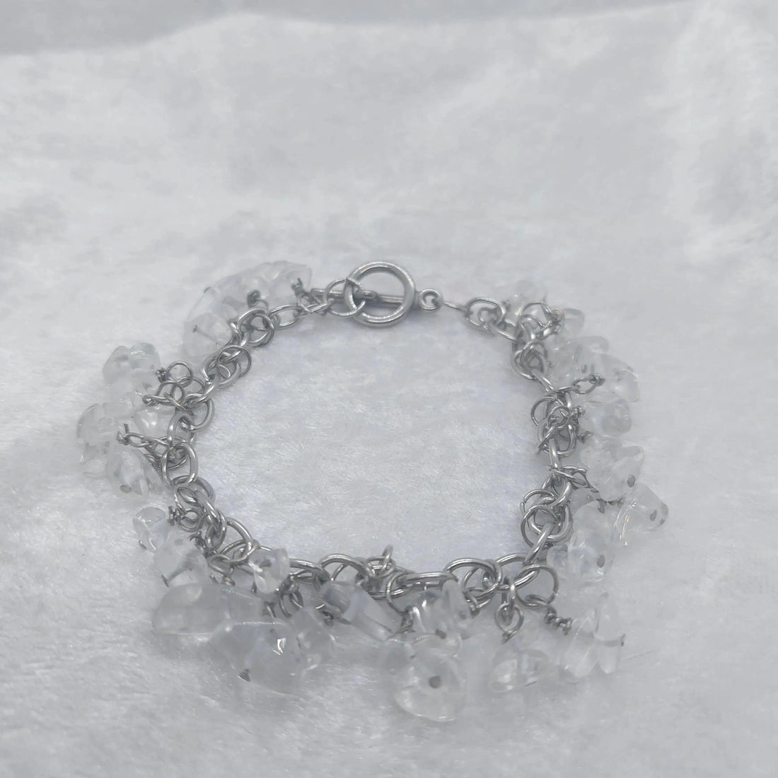 Clear quartz chip bracelet on a stainless steel chain, approximately 8 inches long.