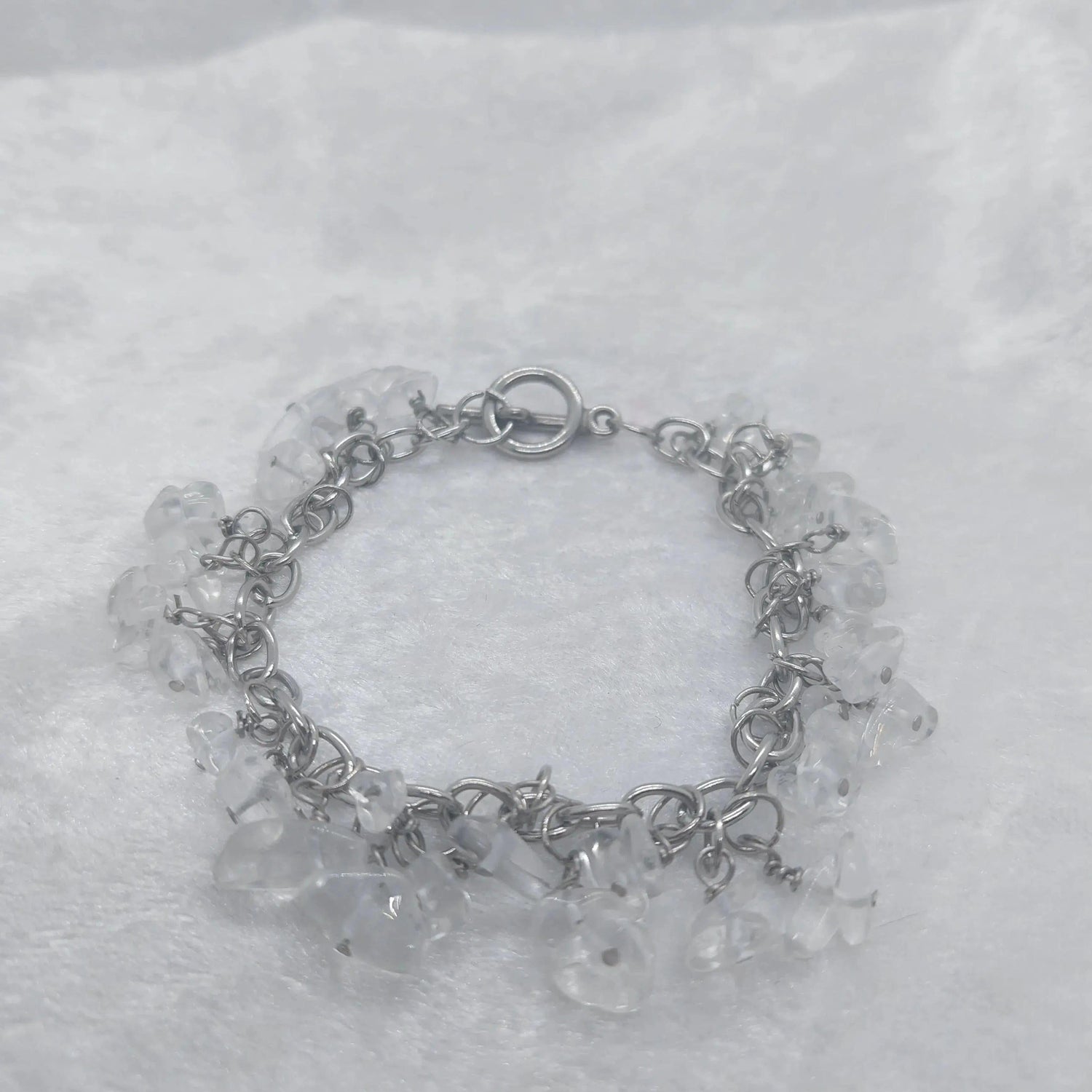 Clear quartz chip bracelet on a stainless steel chain, approximately 8 inches long.